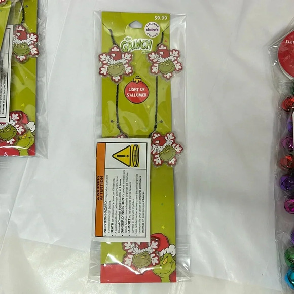 New with tags, the Grinch, Dr. Seuss light up necklace, red snowflakes 
Claire’s - Picture 1 of 4